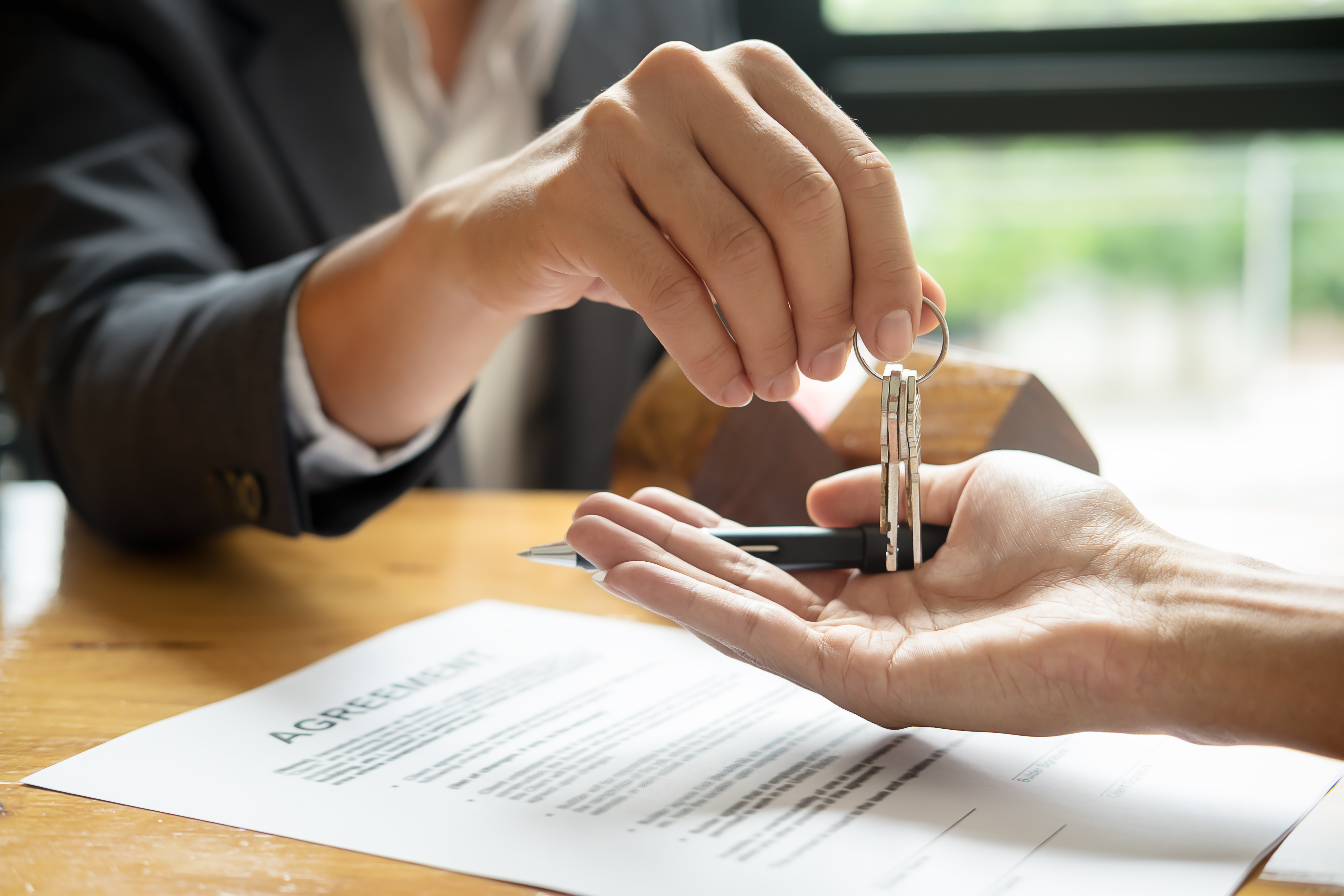 Real Estate Agent Handling Key